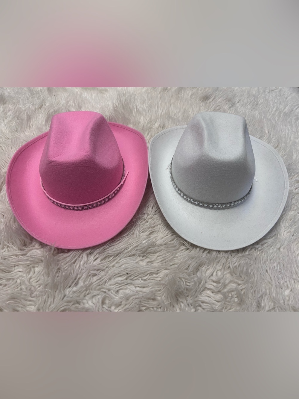 Pink and White Cowboy Hats with Decorative Band